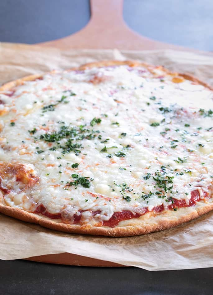 This keto pizza recipe is the perfect easy way to add some low carb eating to your life. It even has that perfect thin crust pizza "chew."