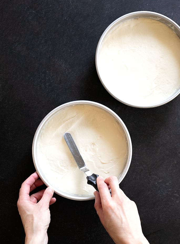 This bakery-style gluten free white cake, made without any egg yolks, is the perfect moist and tender blank canvas to dress up for any occasion.