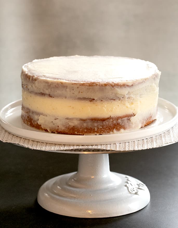 This bakery-style gluten free white cake, made without any egg yolks, is the perfect moist and tender blank canvas to dress up for any occasion.