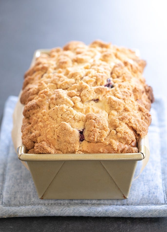 This gluten free blueberry muffin bread is a tender and rich quick bread made with sour cream, packed with fresh blueberries. Crumble topping (sort of) optional.