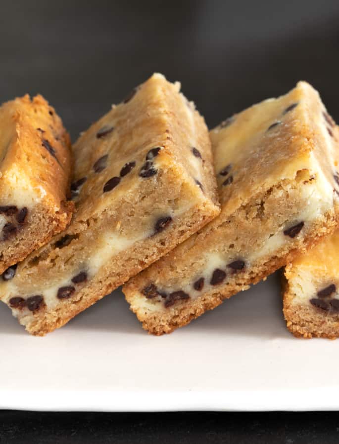 A stack of cheesecake blondies pictured from the side