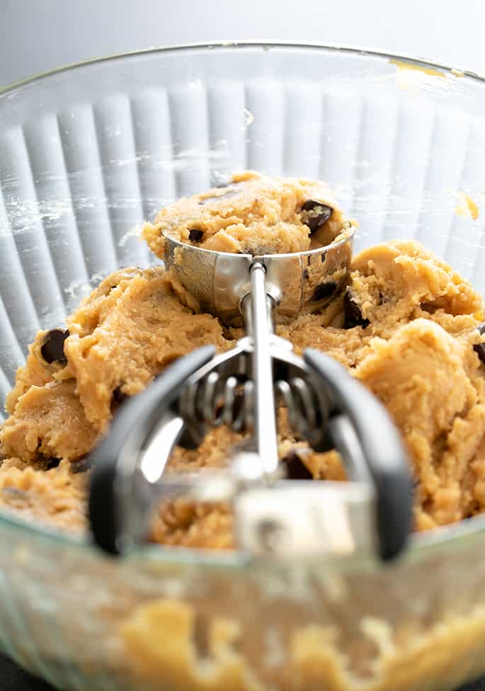 peanut butter cookie dough in an ice cream scooper