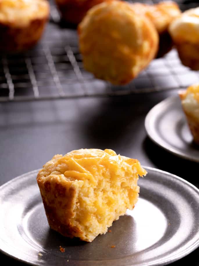 These savory gluten free breakfast corn muffins can be made with or without a whole egg cracked right on top before they go into the oven. The perfect make-ahead breakfast for busy mornings!