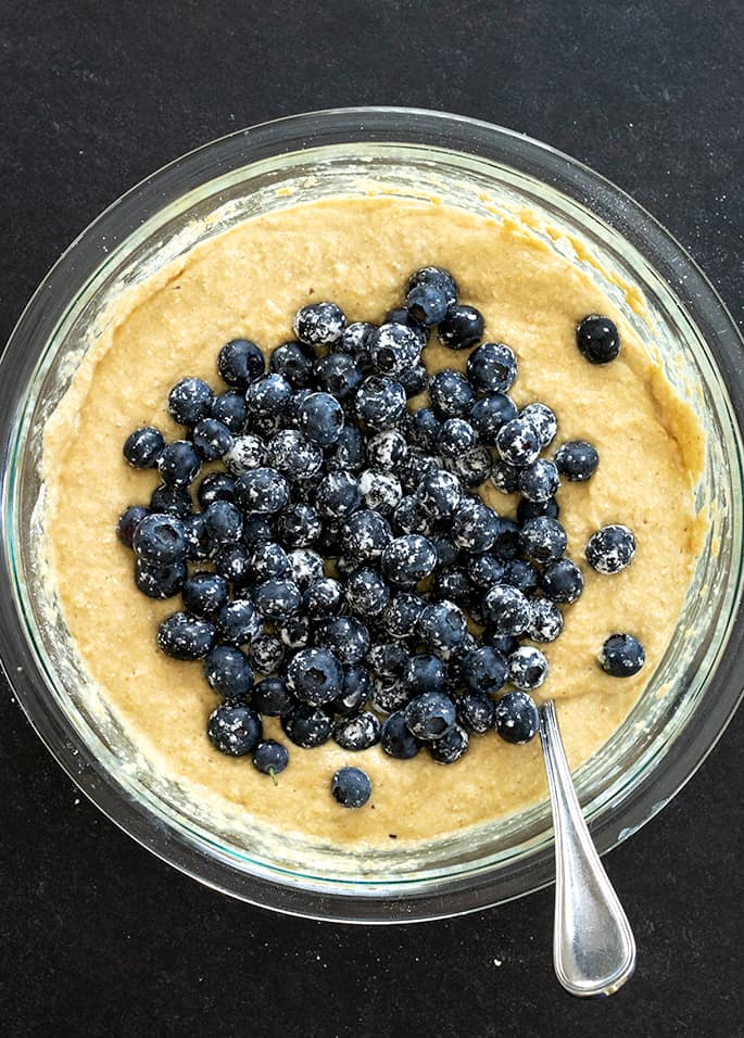 Raw batter for healthy blueberry muffins in a bowl