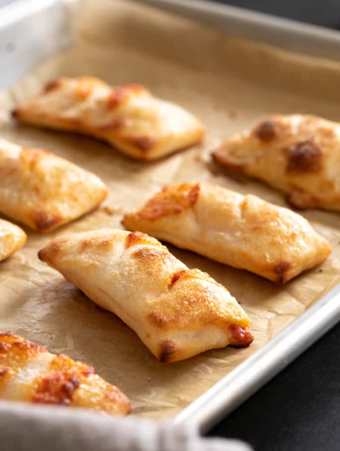 Gluten free pizza rolls are the perfect finger food are they're surprisingly easy to make. They even reheat well for an after-school snack!