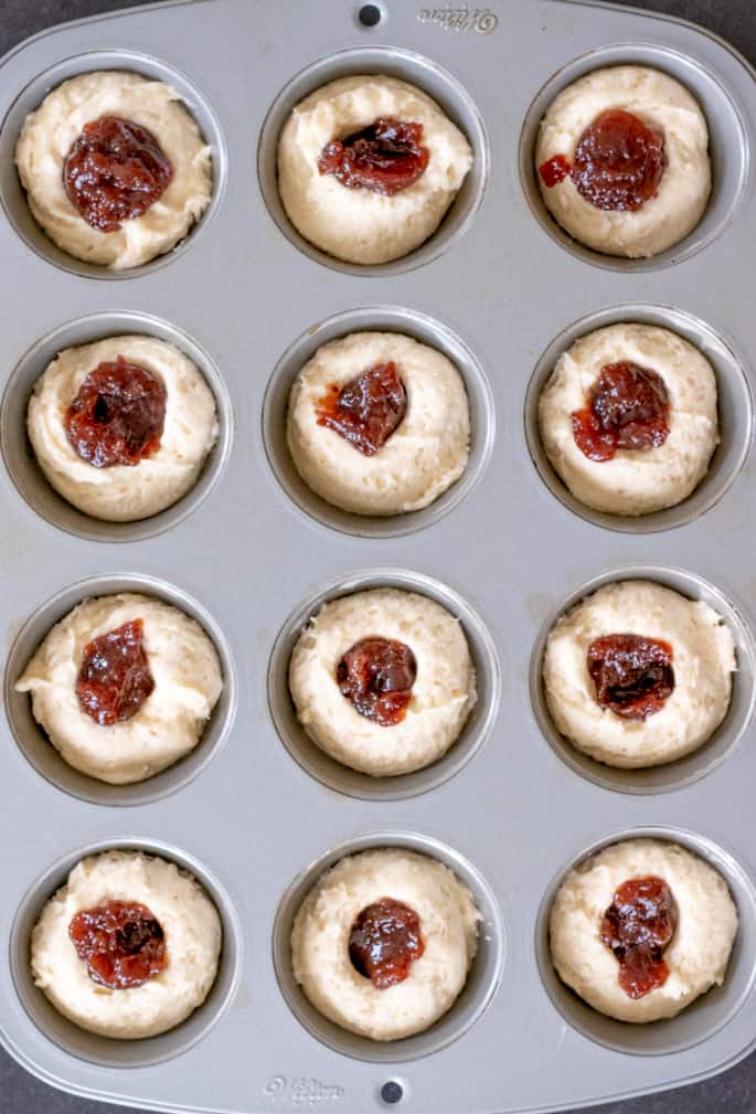 These extra tender gluten free donut muffins with jam filling taste like an old-fashioned cake donut, but they're baked easily in a muffin tin.