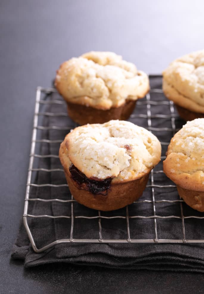 These extra tender gluten free donut muffins with jam filling taste like an old-fashioned cake donut, but they're baked easily in a muffin tin.