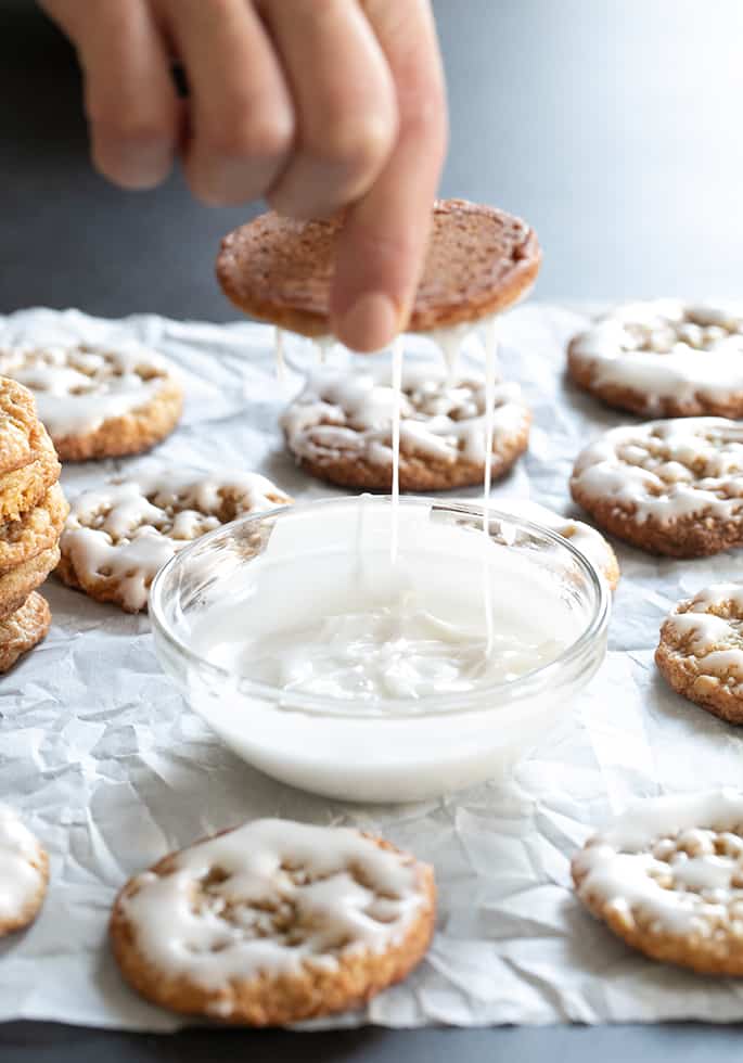 Icing dripping off of gluten free iced oatmeal cookies