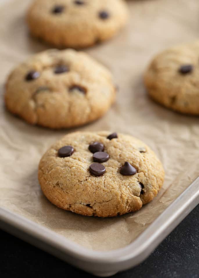 Chocolate chip protein cookies baked on tray, just out of the oven.