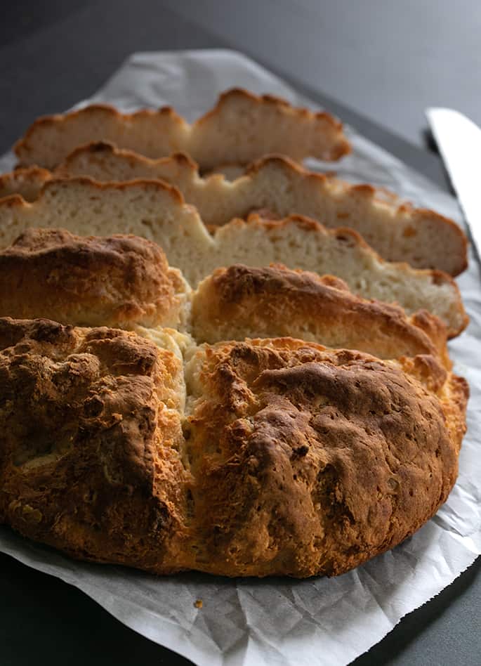 Gluten free savory Irish soda bread sliced from behind.