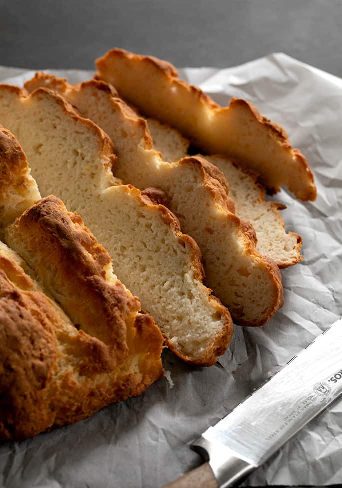 Gluten free savory Irish soda bread sliced, showing the moist and tender crumb. 