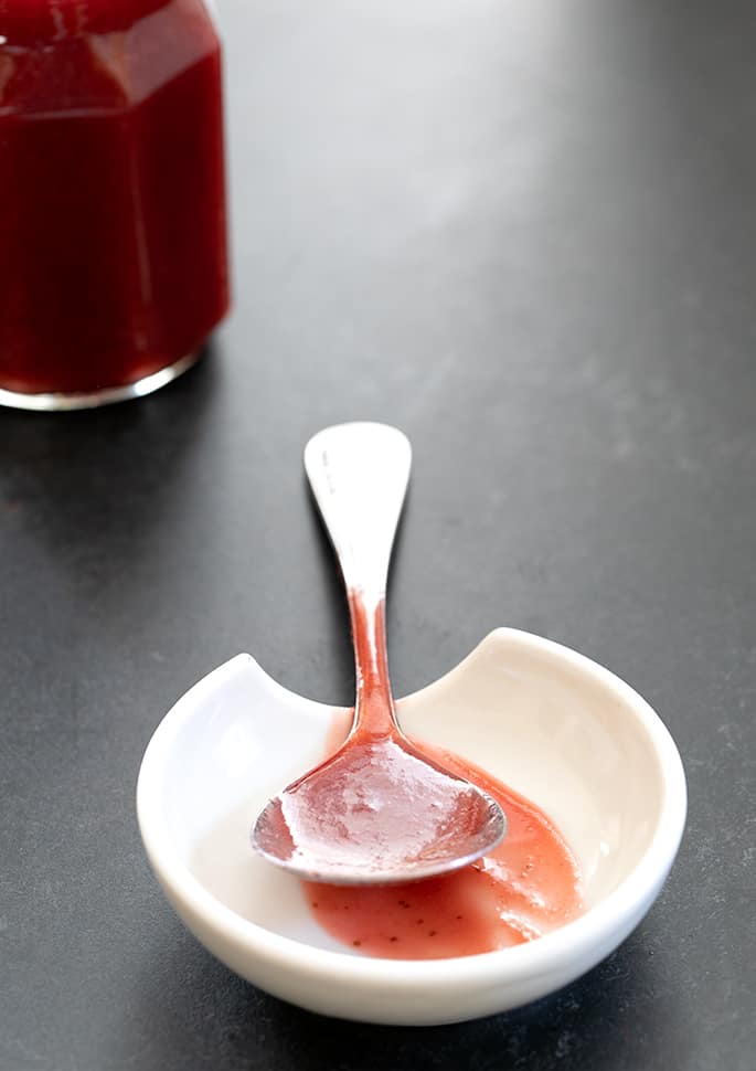 Serving spoon with strawberry puree