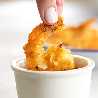 https://glutenfreeonashoestring.com/wp-content/uploads/2020/07/Coconut-shrimp-being-dipped-315x315-1.jpg