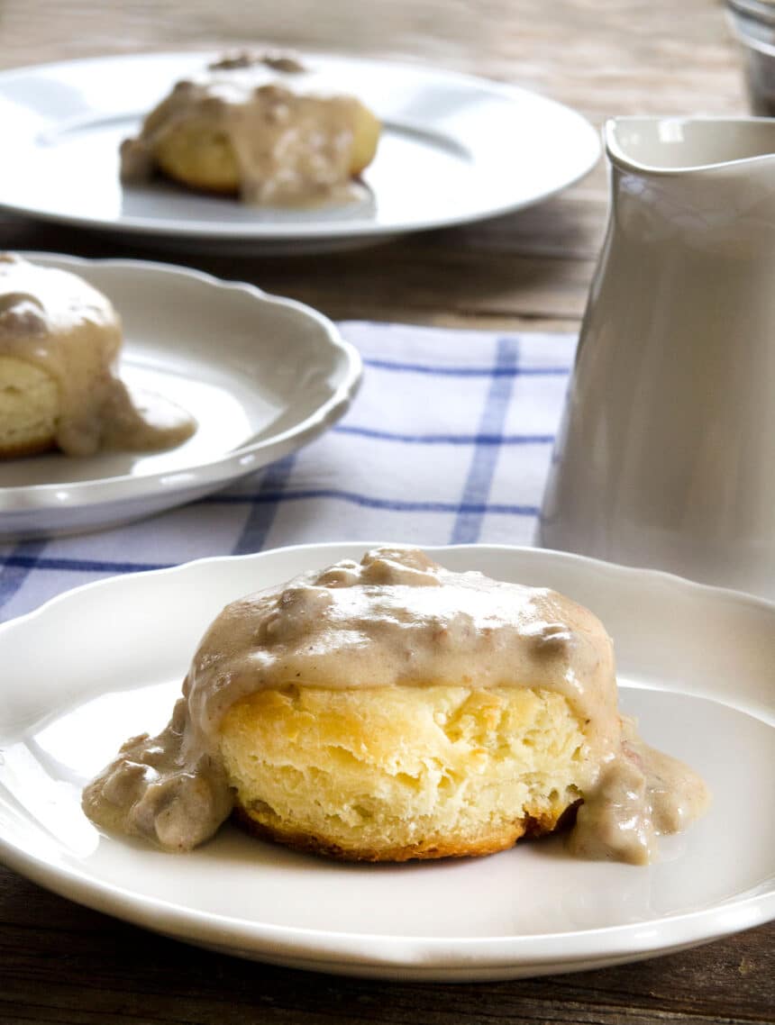 The finished gluten free biscuits and gravy recipe served on a white plate.
