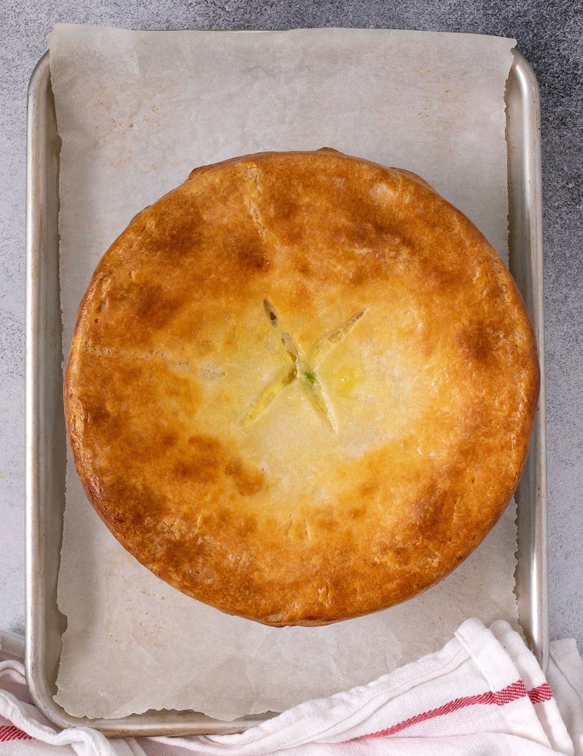 Baked pie crust on round white casserole dish