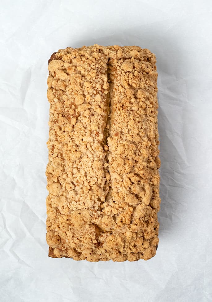 Whole baked loaf of apple butter bread overhead image