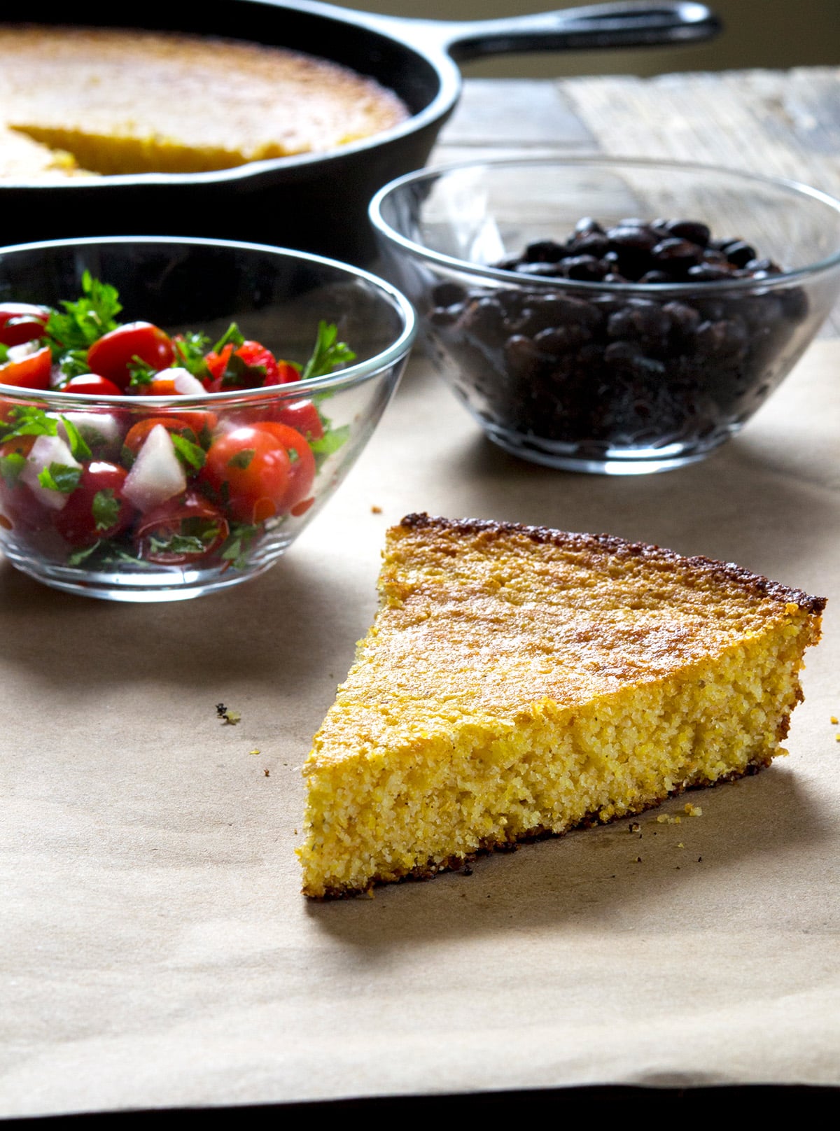Old Fashioned Gluten Free Cornbread A slice of gluten free cornbread with beans and salsa.