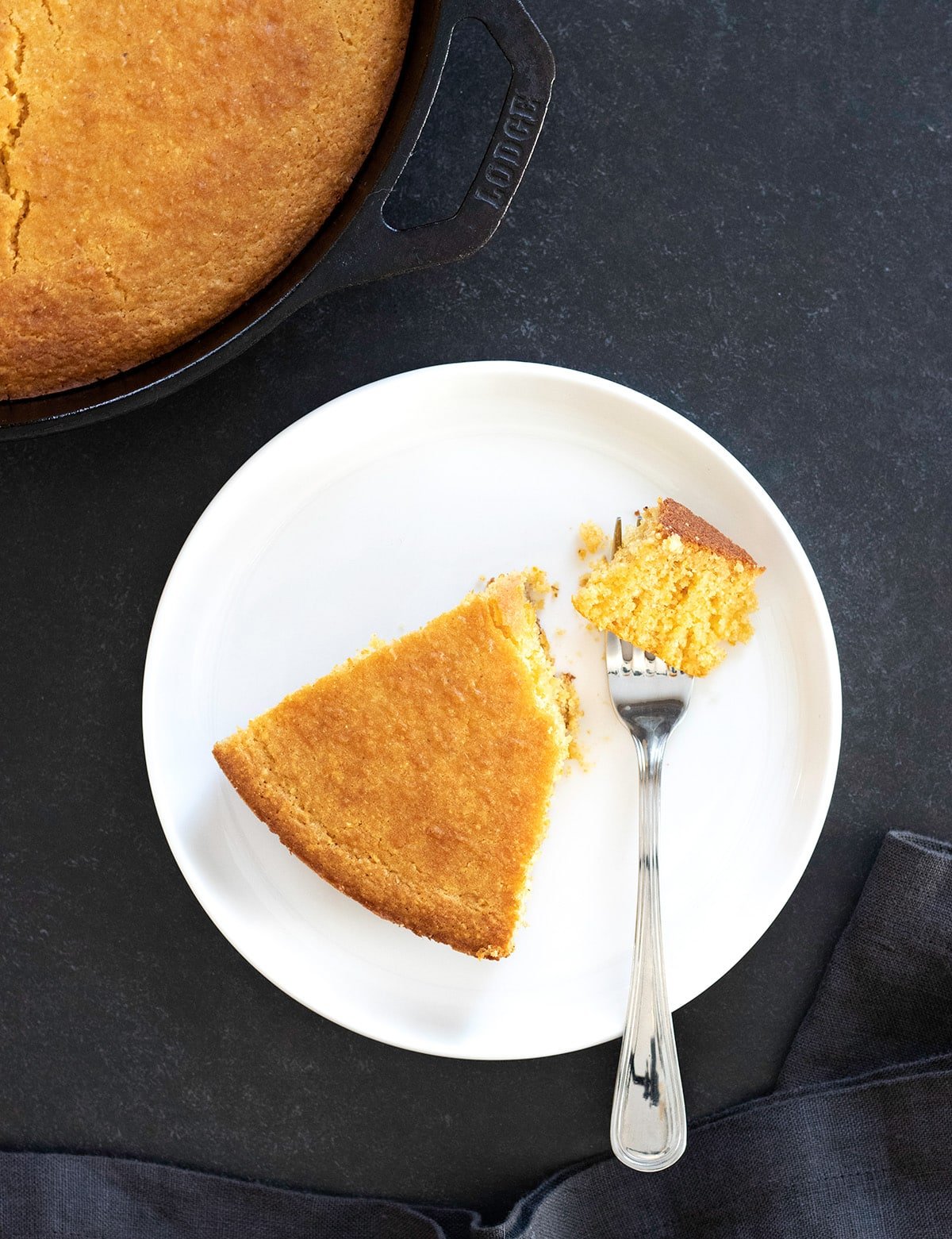 Old fashioned gluten free cornbread corn flour variation, slice on plate with forkful.
