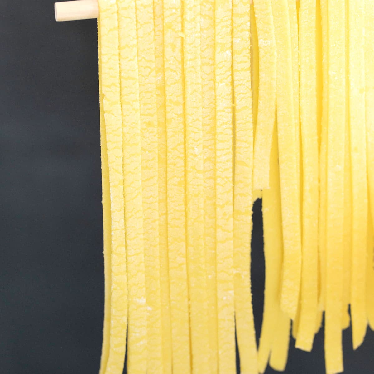 fettuccine gluten free egg noodles on drying rack