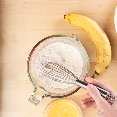 Whisking dry ingredients for banana pancakes