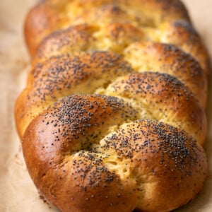 braided gluten free challah bread on brown paper