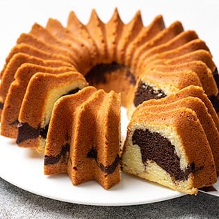 Marble bundt cake with 2 slices on platter 315x315