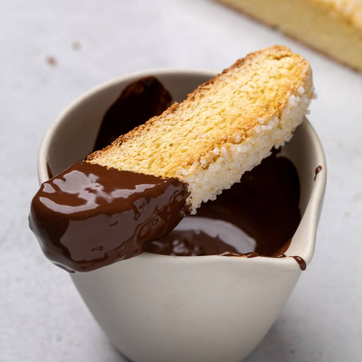 gluten free biscotti with coarse sugar dipped in chocolate