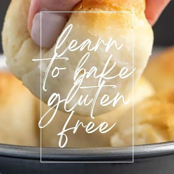 "learn to bake gluten free" text on top of image of fingers squishing a roll