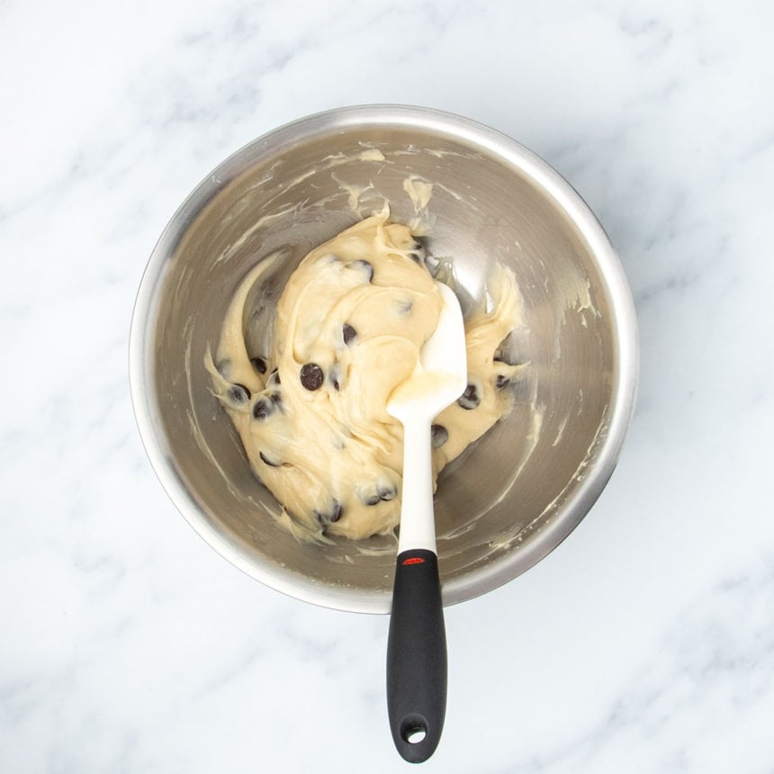 Finished muffin batter with chocolate chips folded in, ready for portioning.