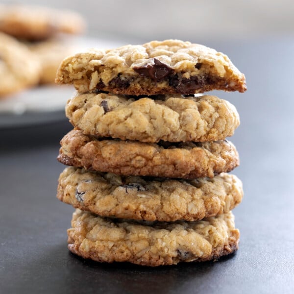 stack of 6 gluten free oatmeal cookies with top cookie broken in half