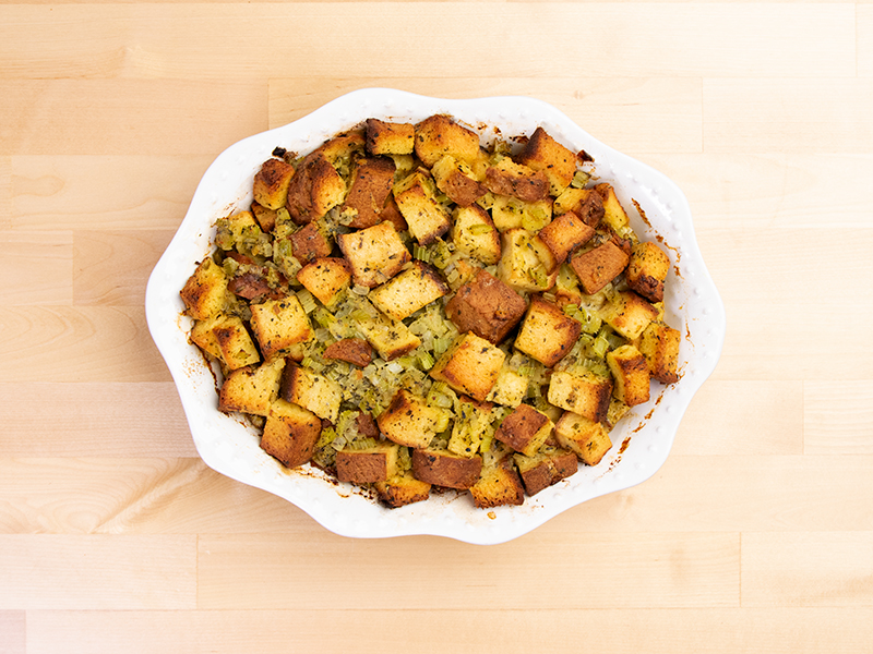 baked gluten free stuffing overhead image in white casserole dish