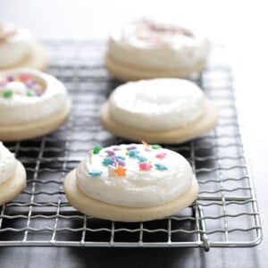 gluten free sugar cookies with frosting on wire rack