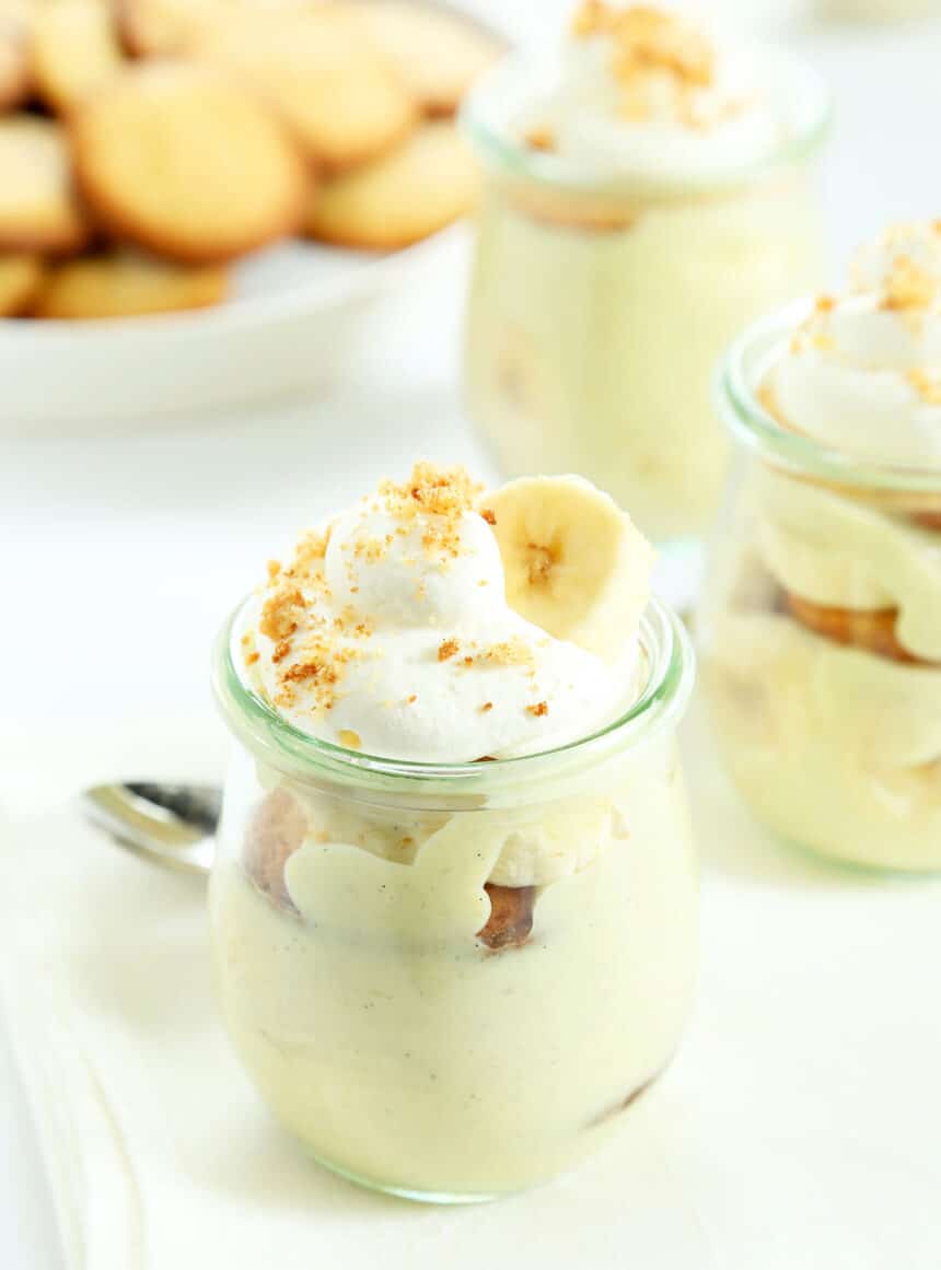 Close up of banana pudding on jar on white plate 