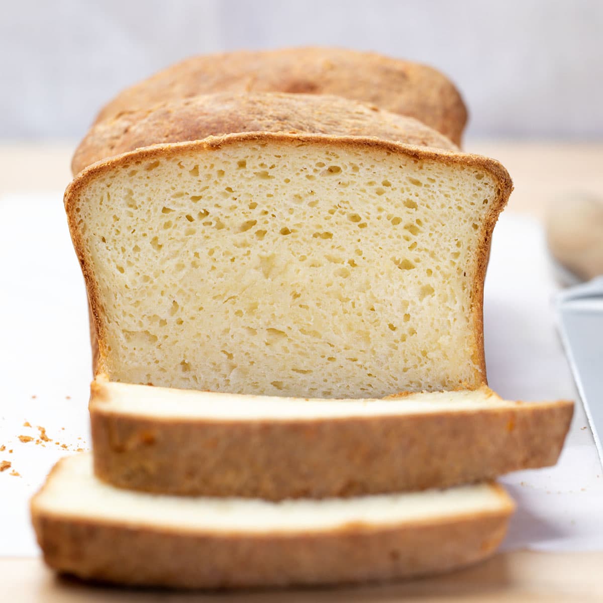 Loaf of gluten free Japanese milk bread with two slices cut