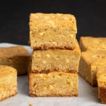 Stack of 3 gluten free blondies on white paper