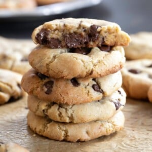 stack of 5 gluten free chocolate chip cookies top one broken