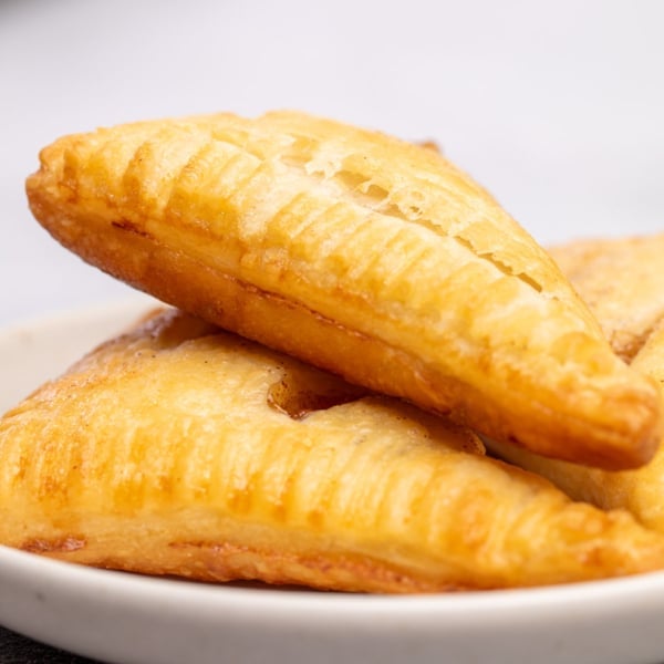 light brown gluten free apple turnovers made from gluten free puff pastry