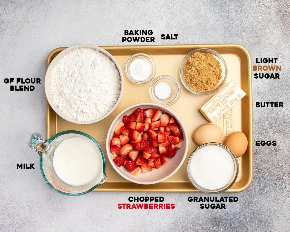 Strawberry muffin ingredients on tray with words of each ingredient.