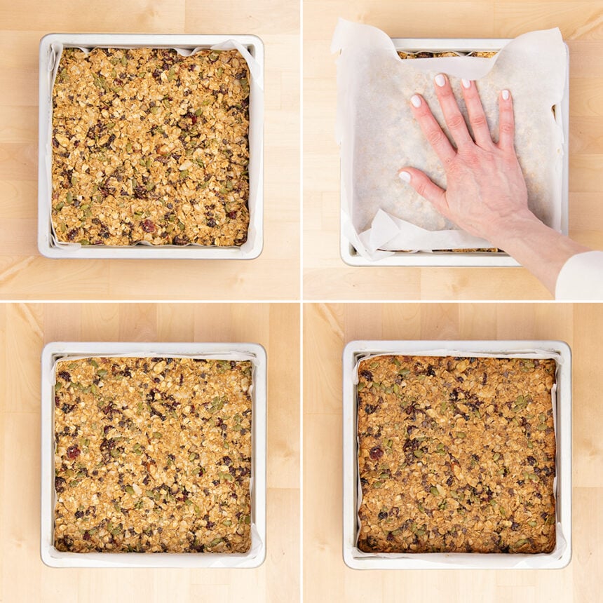 light brown gluten free granola bar mixture in metal baking pan, with hand pressing down on white paper over mixture in pan, then granola bars baked in pan