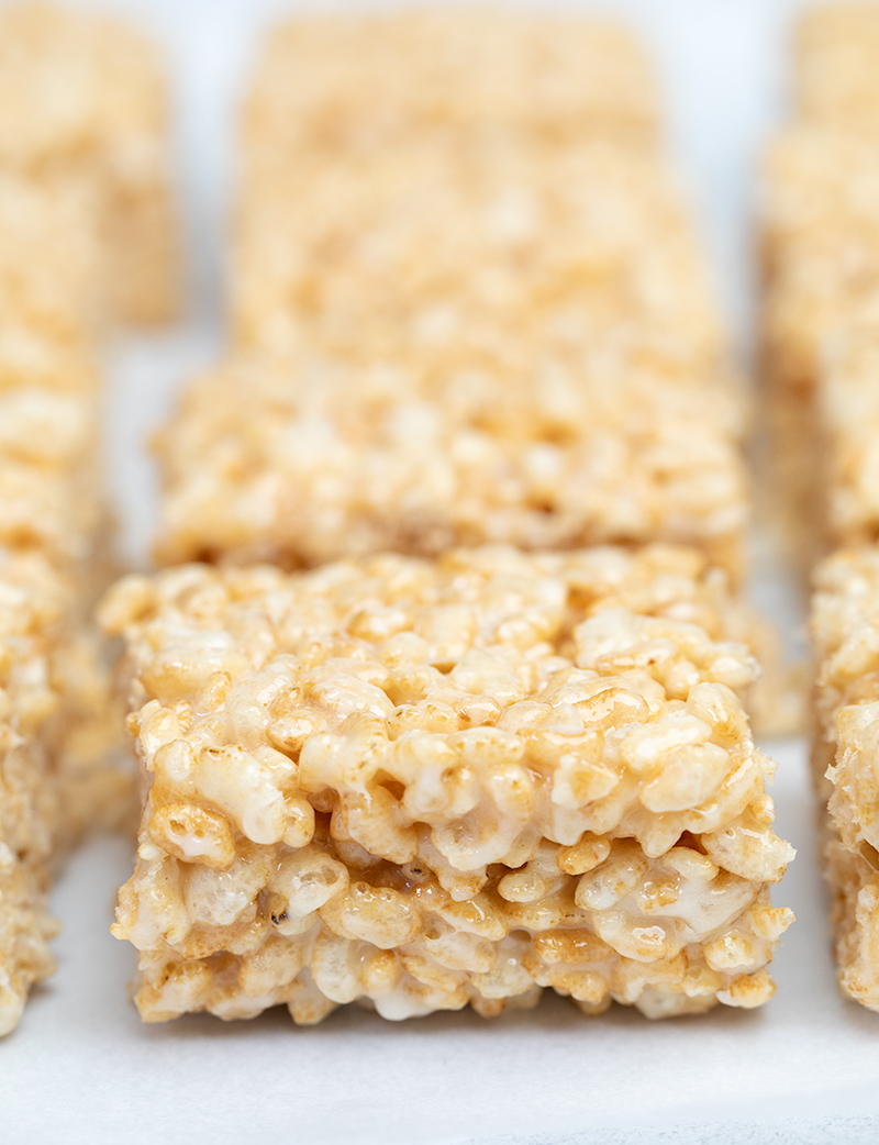 Closeup image of side of square gluten free rice krispie treats