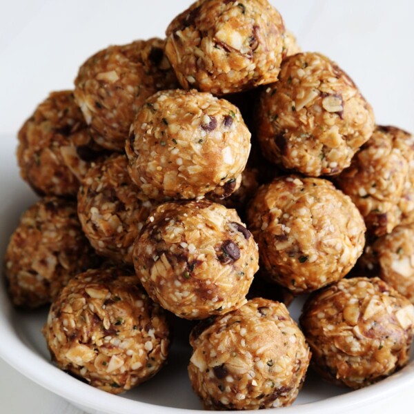 protein balls in stack on white plate