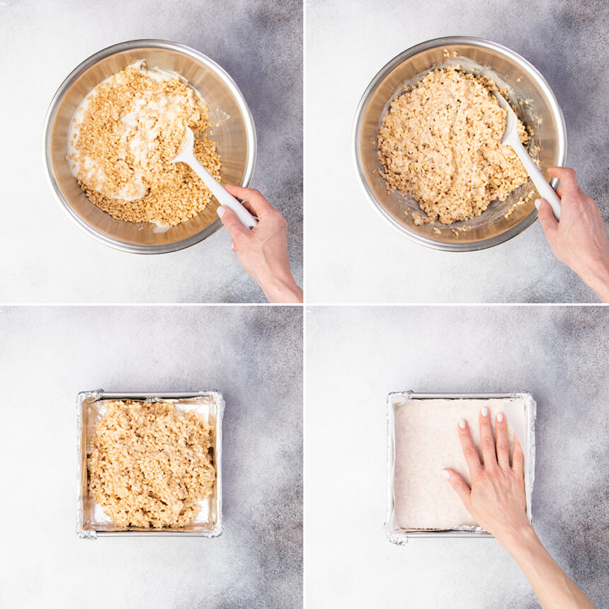 Mixing pale brown rice krispie treat mixture then shaping in square metal baking pan with hand on top of white paper to smooth the top