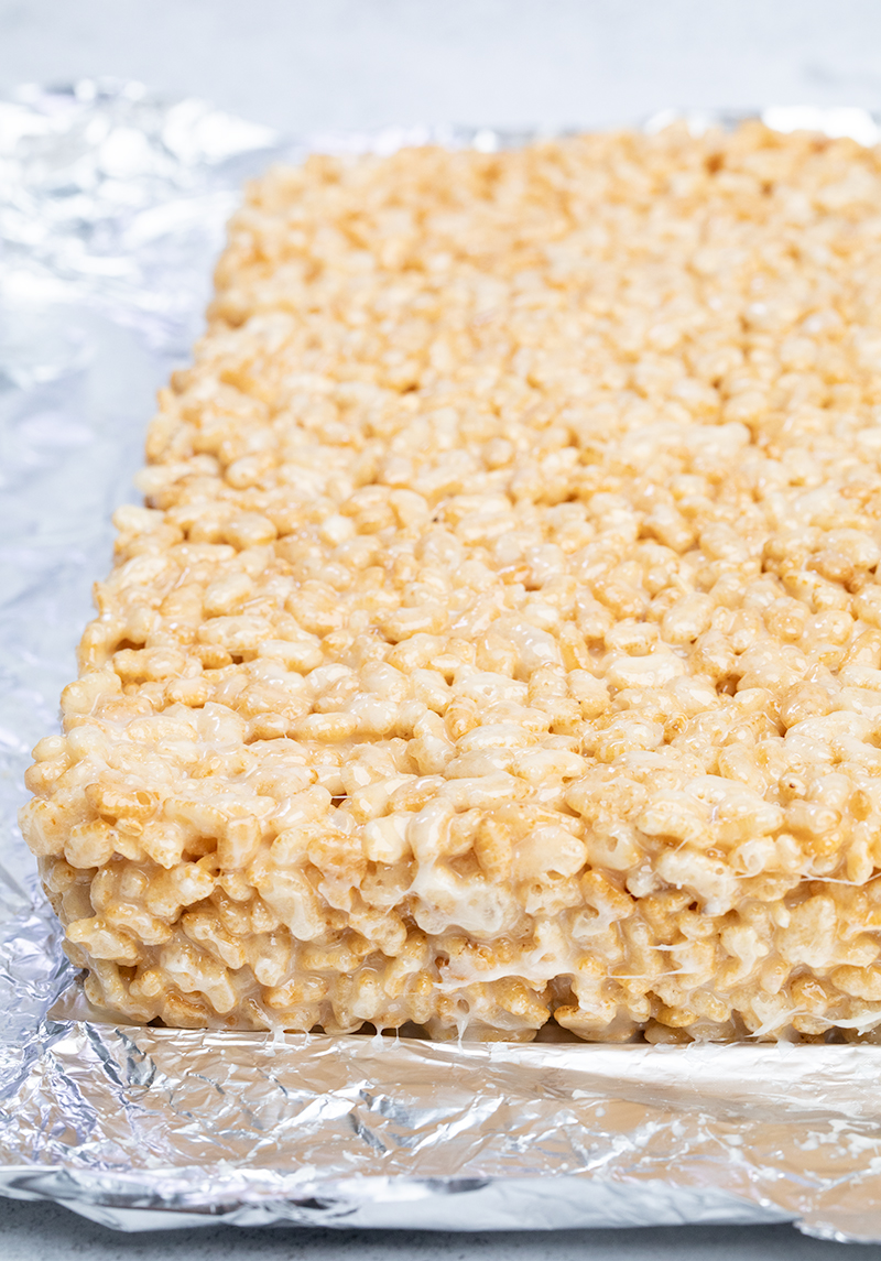 Whole uncut rice krispie treats in foil peeled away