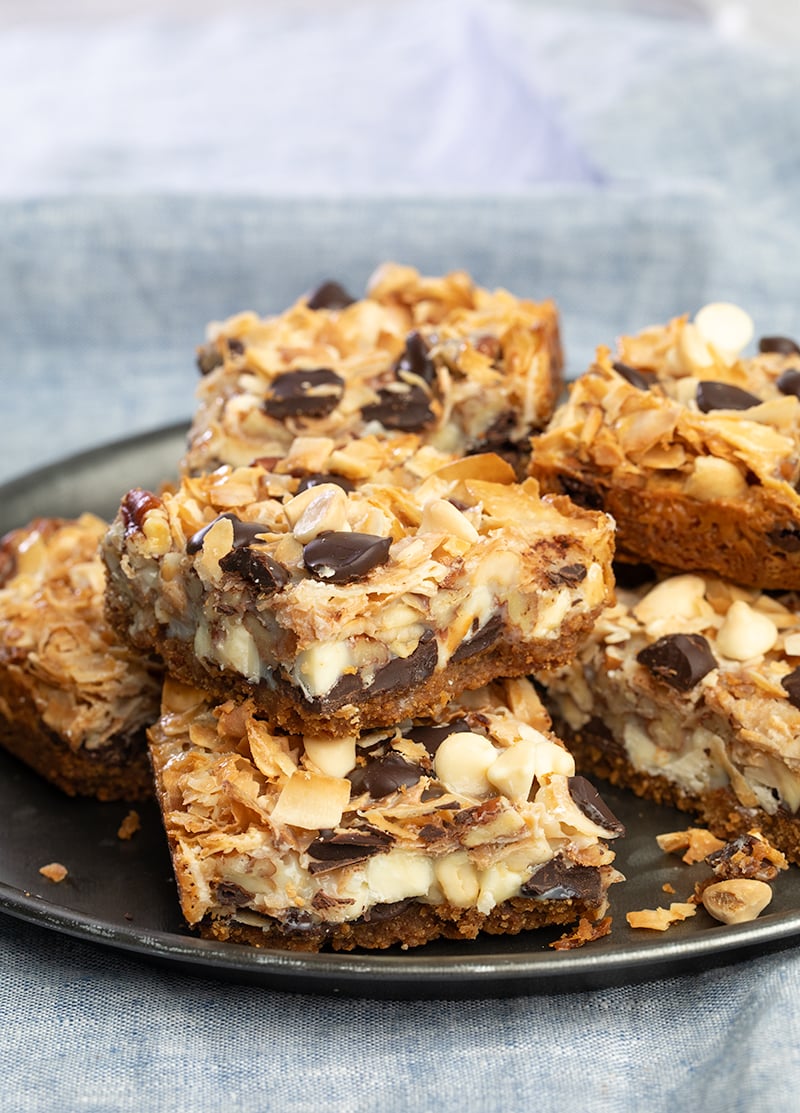 7 layer bars on dark gray serving plate in stack