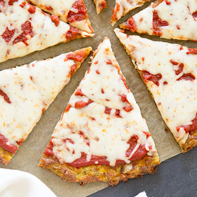 Baked and topped zucchini pizza sliced