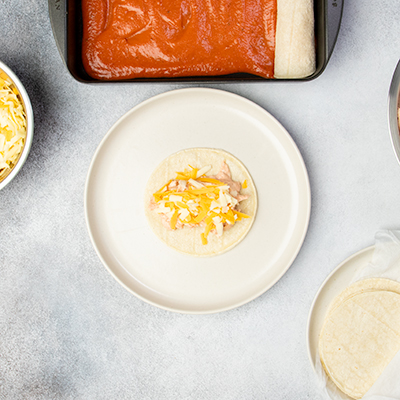 Corn tortilla with chicken and shredded cheese