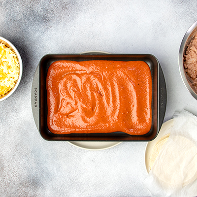 Sauce on bottom of casserole dish to make gluten free enchiladas