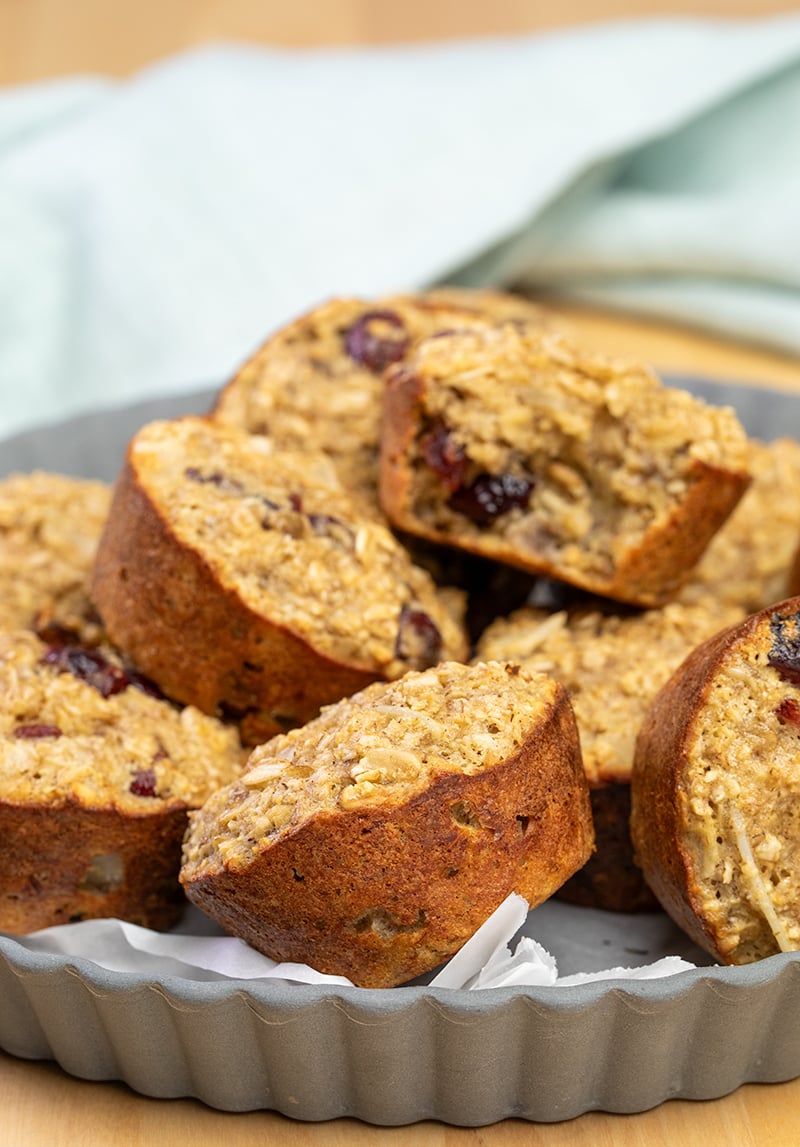 pile of baked oatmeal cups in gray tart pan