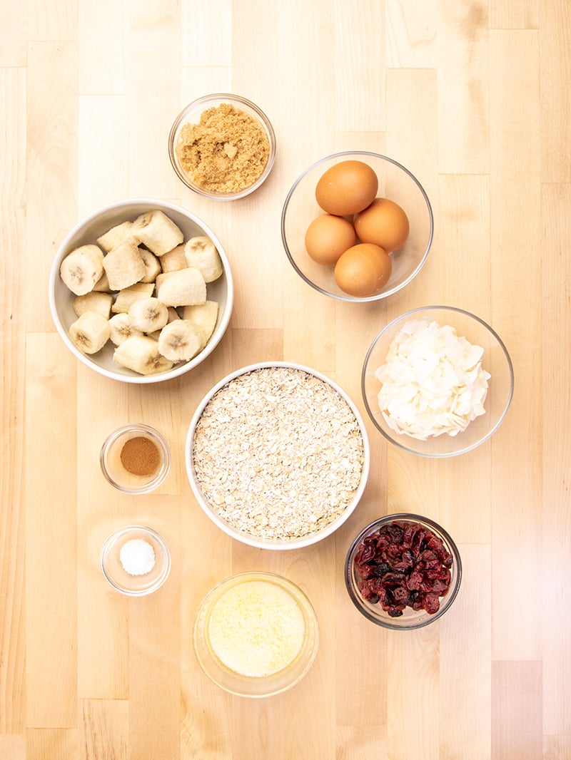 baked oatmeal cups ingredients in small bowls