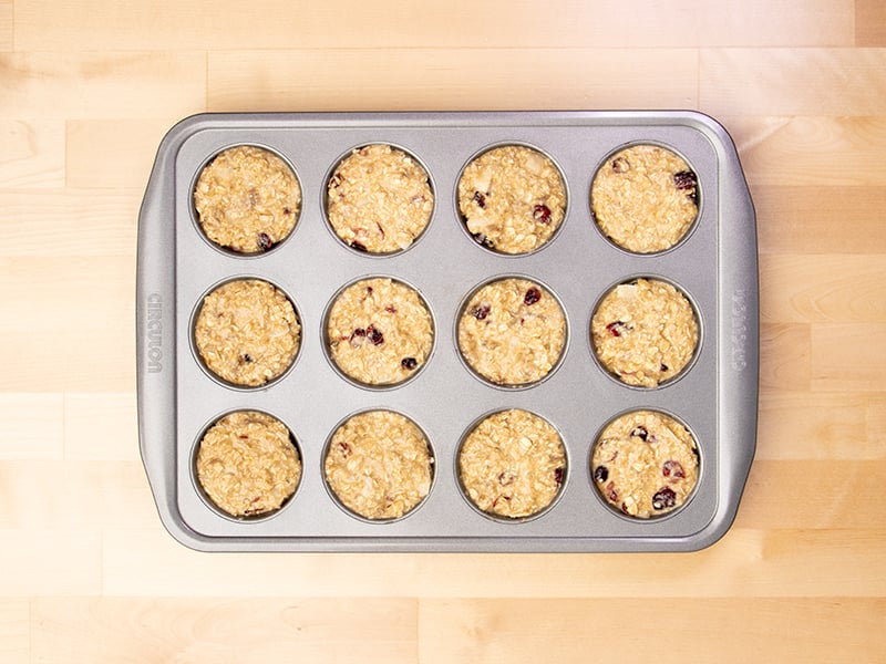 raw batter for baked oatmeal cups in metal 12 cup standard muffin tin